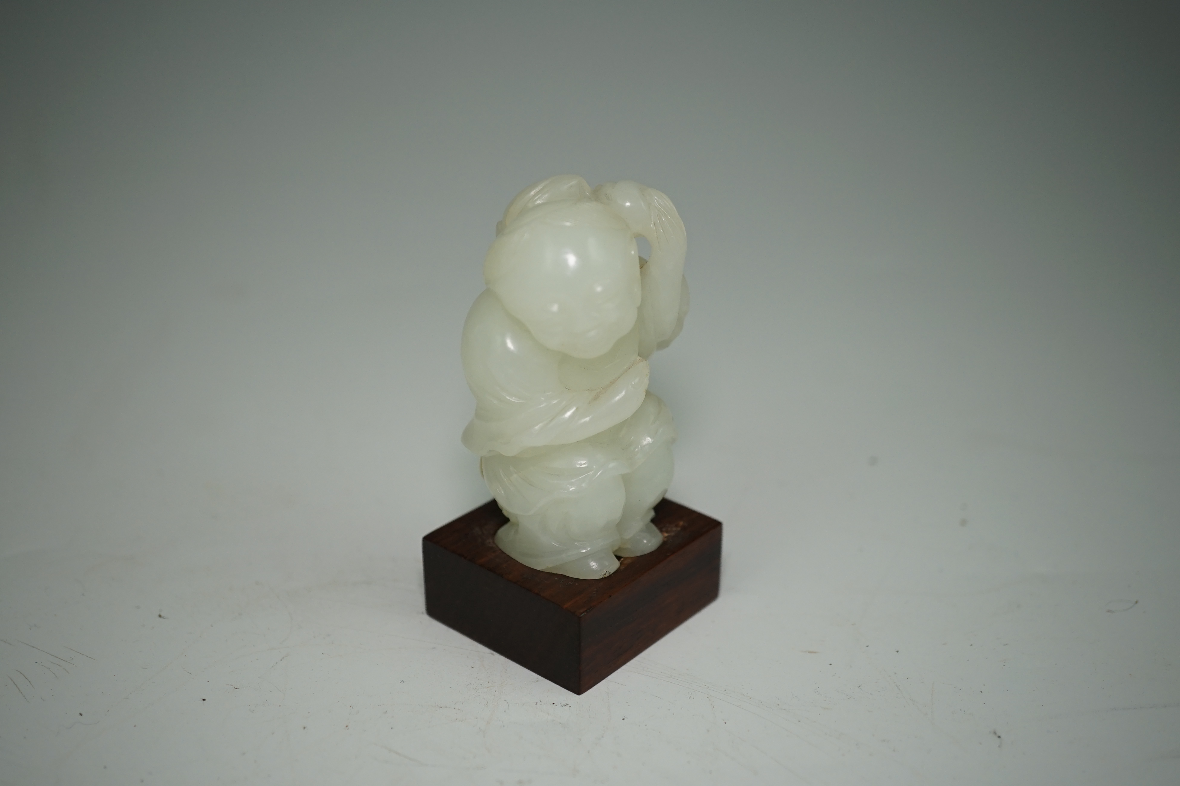 A Chinese white jade figure of Liu Hai, 18th-19th century